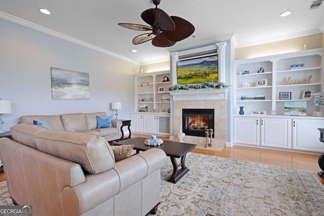 12 Par Dr, Jesup, GA 31546 - living room with a ceiling fan, a fireplace, crown molding, light wood-style floors, and recessed lighting