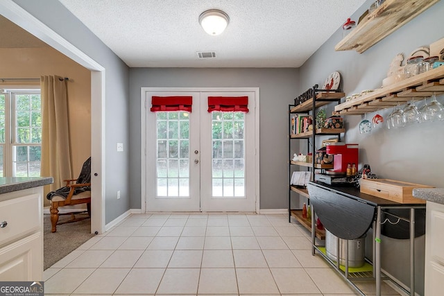 79 Churchill Ct, Richmond Hill, GA 31324 - doorway with a textured ceiling and french doors