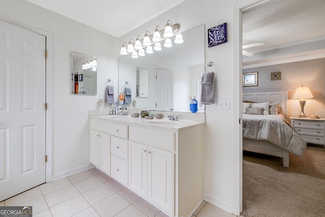 79 Churchill Ct, Richmond Hill, GA 31324 - ensuite bathroom with double vanity, tile patterned flooring, and a textured ceiling