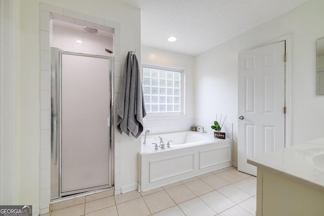 79 Churchill Ct, Richmond Hill, GA 31324 - full bath with a stall shower, a garden tub, vanity, and tile patterned floors