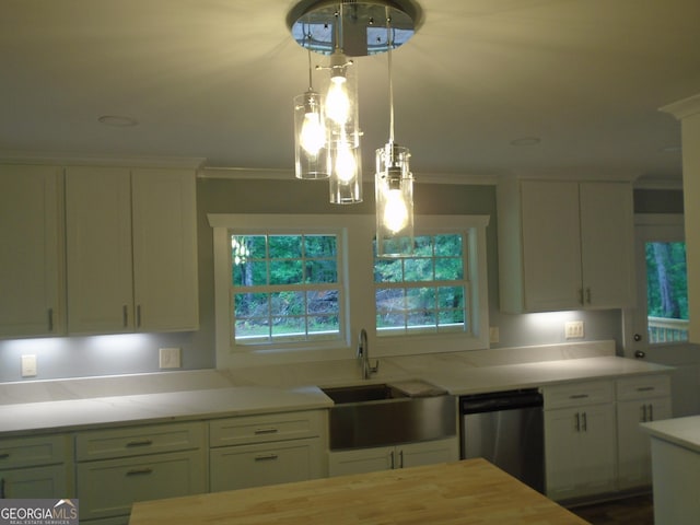 621 Zebulon Rd, Milner, GA 30257 - kitchen featuring dishwasher, crown molding, white cabinetry, and hanging light fixtures
