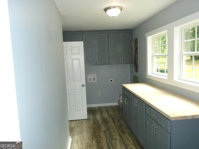 621 Zebulon Rd, Milner, GA 30257 - laundry room with cabinet space, hookup for an electric dryer, washer hookup, and dark wood-style flooring