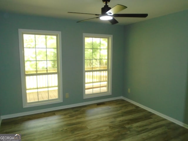 621 Zebulon Rd, Milner, GA 30257 - spare room featuring ceiling fan and dark wood finished floors