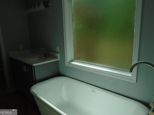 621 Zebulon Rd, Milner, GA 30257 - full bathroom with a freestanding tub and vanity
