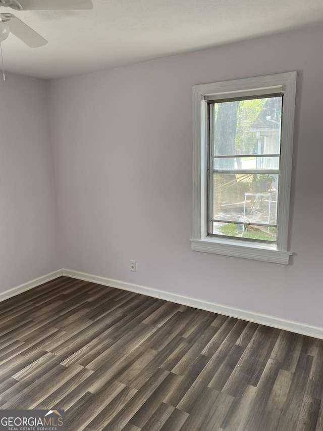 525 Ormond Ter, Macon, GA 31206 - spare room with dark wood-type flooring, a ceiling fan, and baseboards