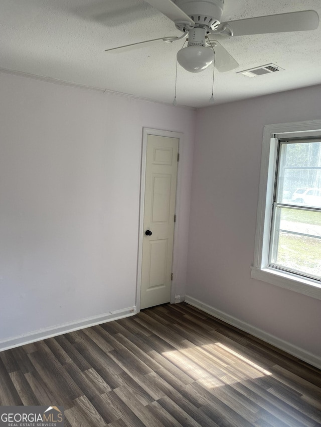 525 Ormond Ter, Macon, GA 31206 - unfurnished room with ceiling fan, dark wood-style floors, baseboards, and a textured ceiling