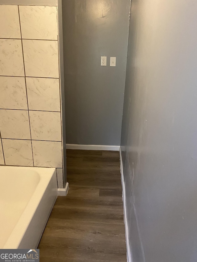 525 Ormond Ter, Macon, GA 31206 - bathroom with wood finished floors, a bath, and baseboards
