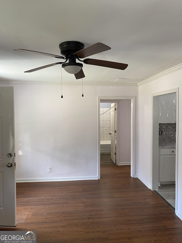 525 Ormond Ter, Macon, GA 31206 - spare room featuring crown molding, ceiling fan, wood finished floors, and baseboards