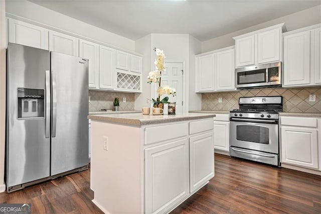 606 Hay Meadow Pl, Acworth, GA 30102 - kitchen featuring stainless steel appliances, a center island, dark wood finished floors, and white cabinetry