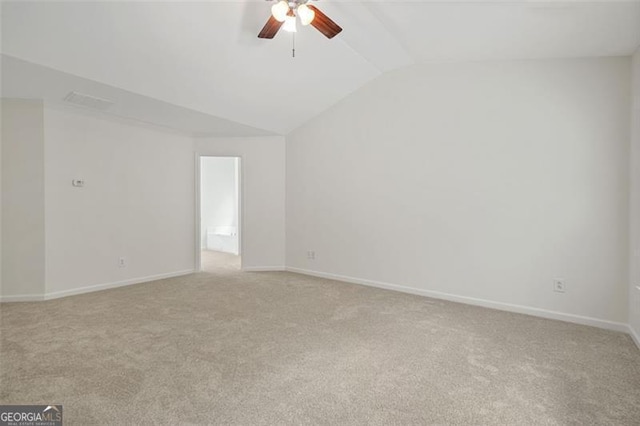 606 Hay Meadow Pl, Acworth, GA 30102 - spare room featuring light carpet, ceiling fan, lofted ceiling, and baseboards