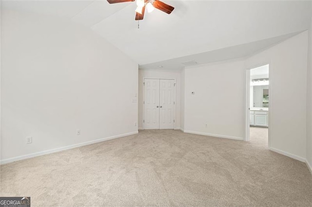 606 Hay Meadow Pl, Acworth, GA 30102 - empty room featuring light colored carpet, vaulted ceiling, a ceiling fan, and baseboards