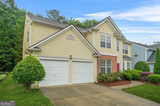 606 Hay Meadow Pl, Acworth, GA 30102 - traditional-style home featuring concrete driveway, a front yard, and brick siding