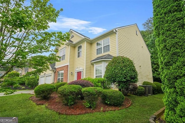 606 Hay Meadow Pl, Acworth, GA 30102 - view of front facade with a garage, a front lawn, and brick siding
