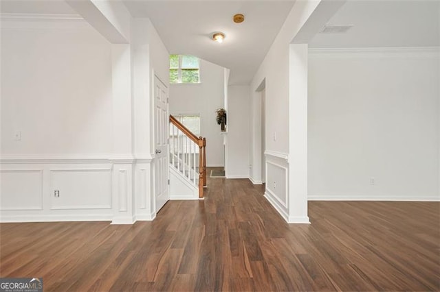 606 Hay Meadow Pl, Acworth, GA 30102 - entrance foyer with wood finished floors, stairway, vaulted ceiling, a decorative wall, and a wainscoted wall