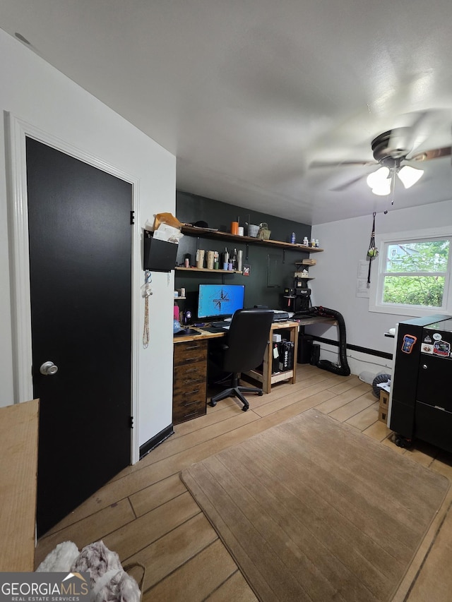 245 Freestone Dr, Newnan, GA 30265 - office featuring light wood-type flooring, a ceiling fan, built in study area, and baseboard heating