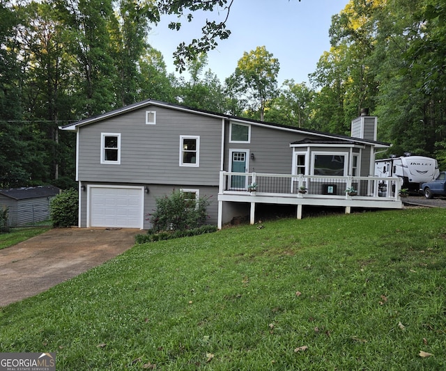 245 Freestone Dr, Newnan, GA 30265 - split level home with an attached garage, driveway, a chimney, a front yard, and a deck