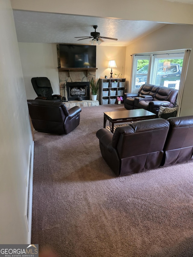245 Freestone Dr, Newnan, GA 30265 - carpeted living area featuring ceiling fan and a fireplace