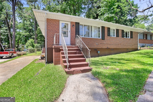 2215 Springdale Rd SW, Atlanta, GA 30315 - view of front of home featuring crawl space, a front yard, brick siding, and driveway