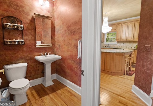 1014 Overlook Dr, Villa Rica, GA 30180 - bathroom with wood finished floors, baseboards, toilet, and a sink