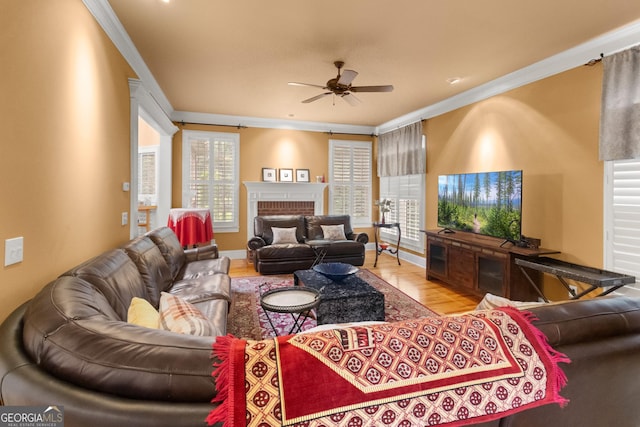 1014 Overlook Dr, Villa Rica, GA 30180 - living area featuring ceiling fan, crown molding, wood finished floors, and a fireplace