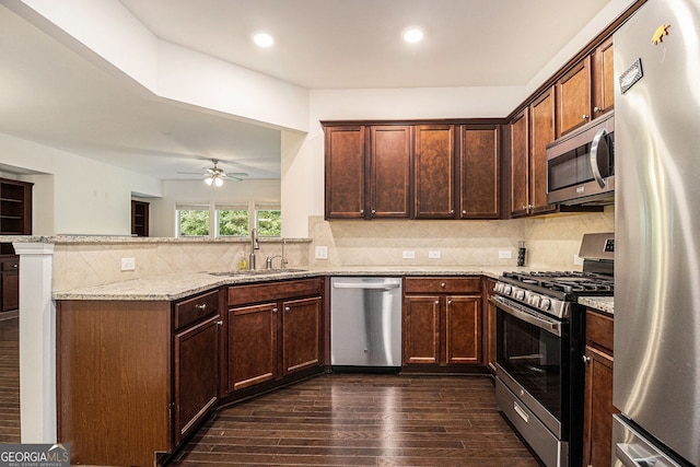 1425 Hampton Oaks Dr, Alpharetta, GA 30004 - kitchen with stainless steel appliances, a sink, a peninsula, dark wood-style floors, and light stone countertops