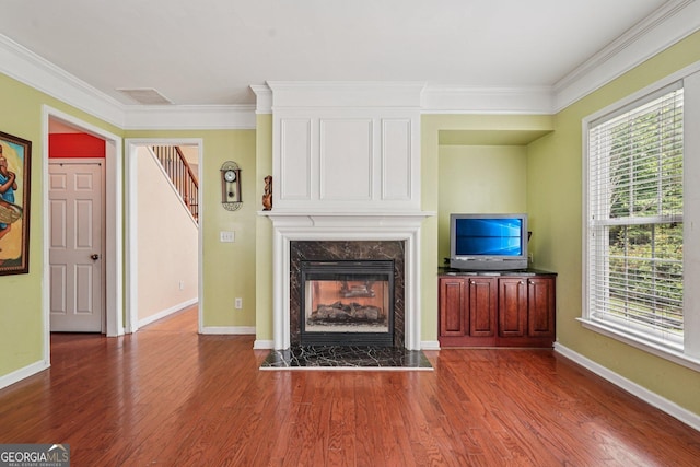 251 Sumac Trl, Woodstock, GA 30188 - living area featuring a high end fireplace, ornamental molding, dark wood-style flooring, and stairs
