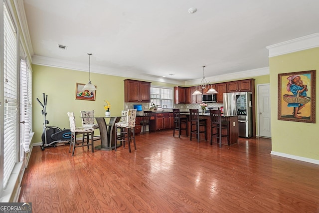 251 Sumac Trl, Woodstock, GA 30188 - dining space with ornamental molding and dark wood-style floors