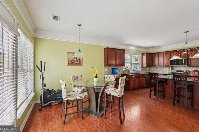 251 Sumac Trl, Woodstock, GA 30188 - dining area featuring dark wood-type flooring and ornamental molding