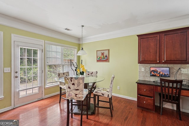 251 Sumac Trl, Woodstock, GA 30188 - dining area with dark wood-style floors and crown molding