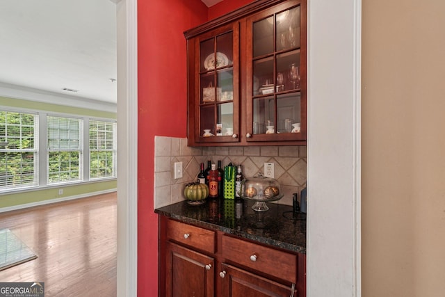 251 Sumac Trl, Woodstock, GA 30188 - indoor dry bar with tasteful backsplash and wood finished floors