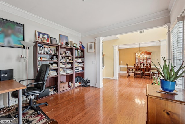251 Sumac Trl, Woodstock, GA 30188 - office space with ornate columns, wood finished floors, crown molding, and a chandelier