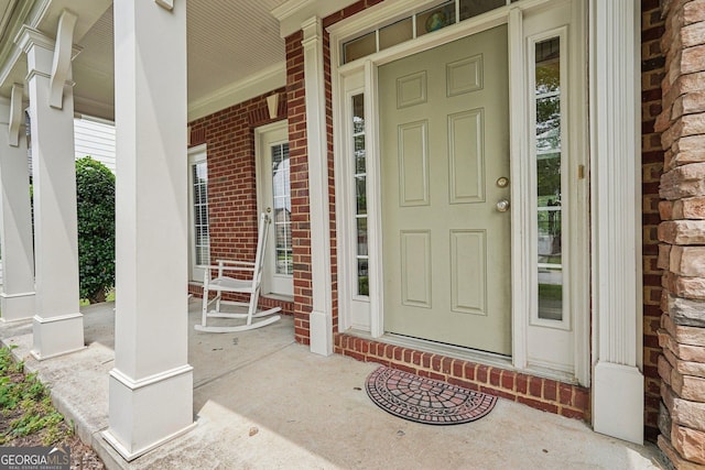 251 Sumac Trl, Woodstock, GA 30188 - view of exterior entry with a porch and brick siding