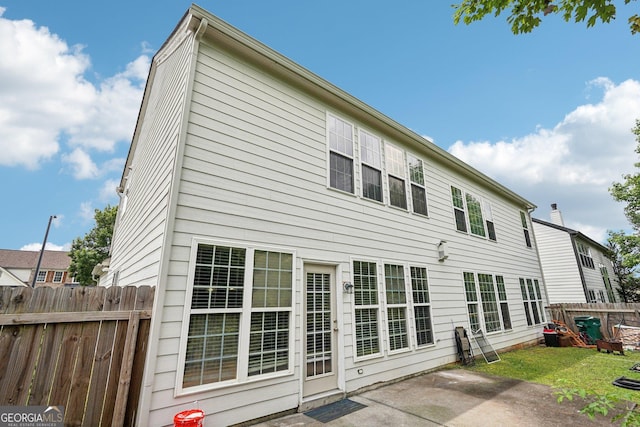 251 Sumac Trl, Woodstock, GA 30188 - rear view of house featuring a patio and a chimney