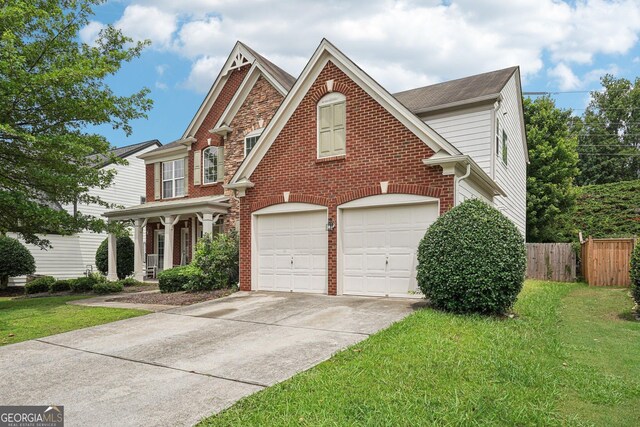 251 Sumac Trl, Woodstock, GA 30188 - view of front of house with a garage, driveway, and brick siding