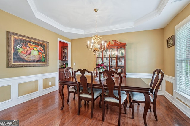 251 Sumac Trl, Woodstock, GA 30188 - dining space with a raised ceiling, wood finished floors, crown molding, wainscoting, and a decorative wall