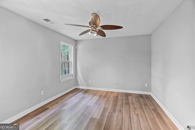 3315 Brookfield Dr, Austell, GA 30106 - spare room with ceiling fan, wood finished floors, a textured ceiling, and baseboards
