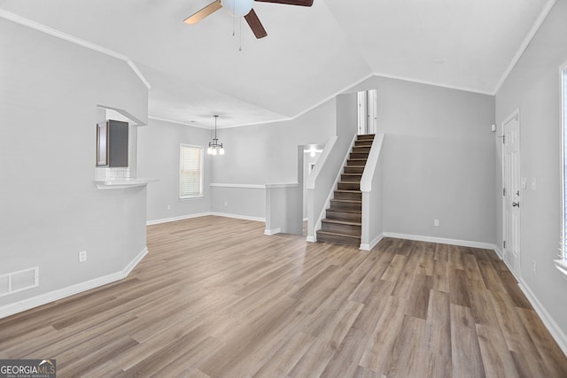 3315 Brookfield Dr, Austell, GA 30106 - unfurnished living room featuring a ceiling fan, ornamental molding, stairs, light wood finished floors, and baseboards