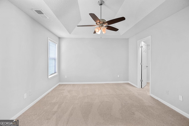 3315 Brookfield Dr, Austell, GA 30106 - unfurnished room featuring ceiling fan, light carpet, baseboards, a tray ceiling, and vaulted ceiling