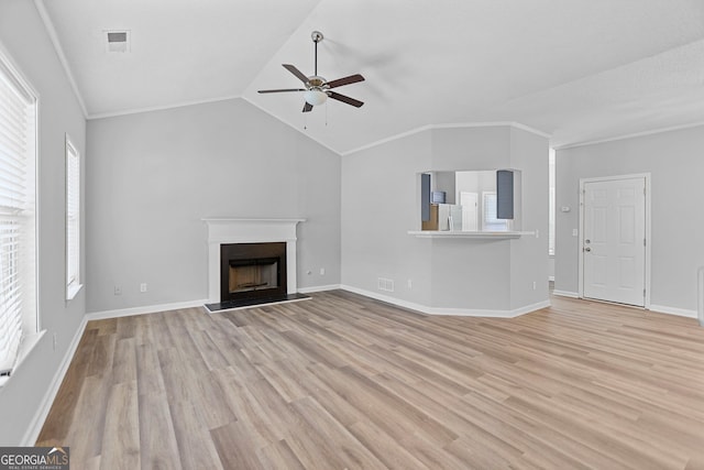 3315 Brookfield Dr, Austell, GA 30106 - unfurnished living room with ceiling fan, light wood-style floors, a fireplace with raised hearth, lofted ceiling, and baseboards