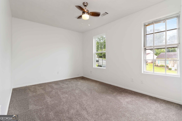 4651 Garden Hills Dr, Stone Mountain, GA 30083 - spare room featuring carpet, baseboards, and a ceiling fan