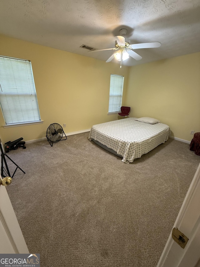 6550 Wellington Chase Ct, Lithonia, GA 30058 - unfurnished bedroom with carpet, baseboards, and ceiling fan