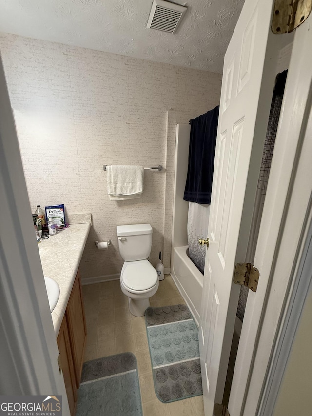 6550 Wellington Chase Ct, Lithonia, GA 30058 - bathroom featuring vanity, toilet, tile patterned flooring, shower / bathtub combination with curtain, and baseboards