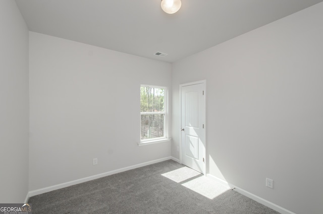 778 Laurel Cove Dr, Hoschton, GA 30548 - spare room featuring carpet and baseboards