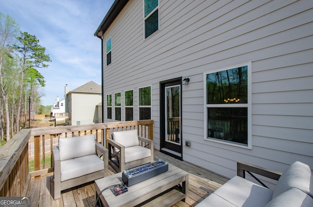778 Laurel Cove Dr, Hoschton, GA 30548 - wooden deck with an outdoor living space with a fire pit