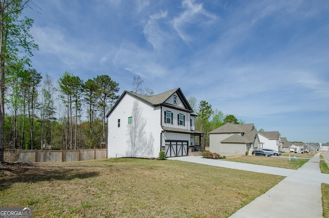 778 Laurel Cove Dr, Hoschton, GA 30548 - view of front of home with concrete driveway, an attached garage, and a residential view