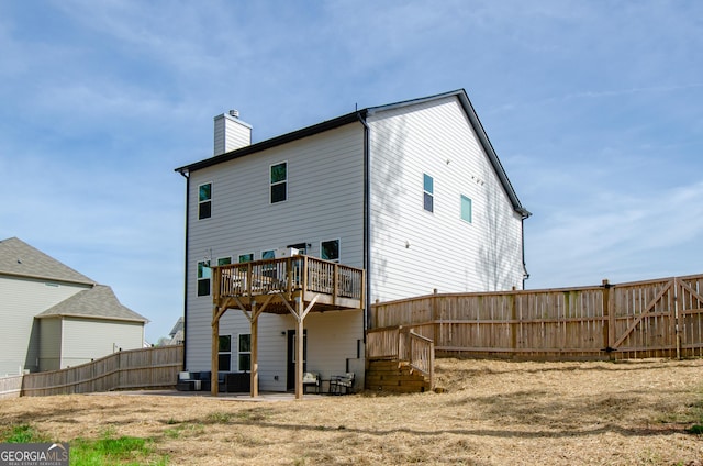 778 Laurel Cove Dr, Hoschton, GA 30548 - back of property featuring a chimney, a fenced backyard, and a patio area