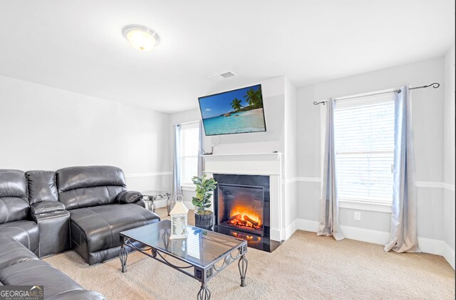 4580 Cloister Cir, Hampton, GA 30228 - living room with a fireplace with flush hearth and carpet