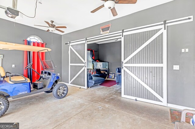 4580 Cloister Cir, Hampton, GA 30228 - garage with a ceiling fan