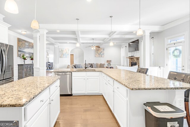 4580 Cloister Cir, Hampton, GA 30228 - kitchen with decorative columns, dishwasher, coffered ceiling, ceiling fan, and open floor plan