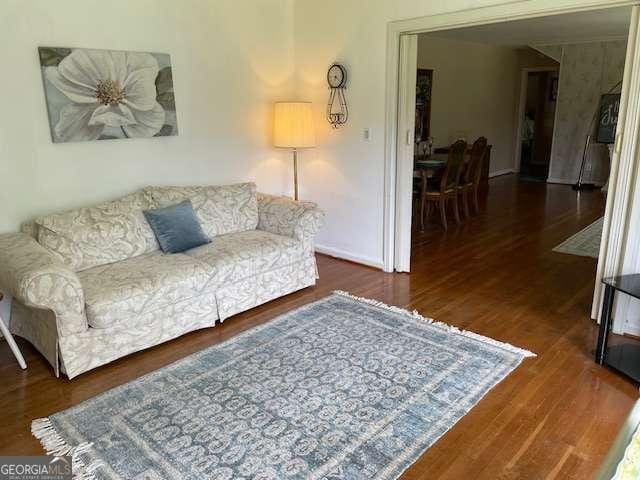 1470 Dunn Rd, Cumming, GA 30040 - living area featuring wood finished floors and baseboards